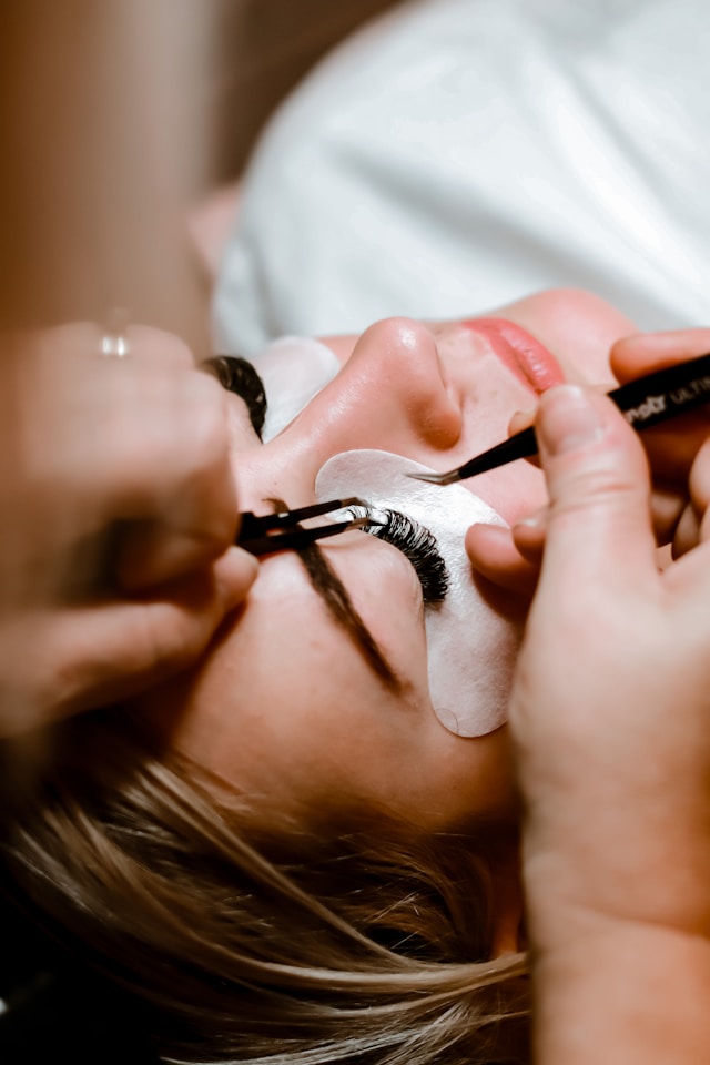 Students practising a service in the cosmetology lab
