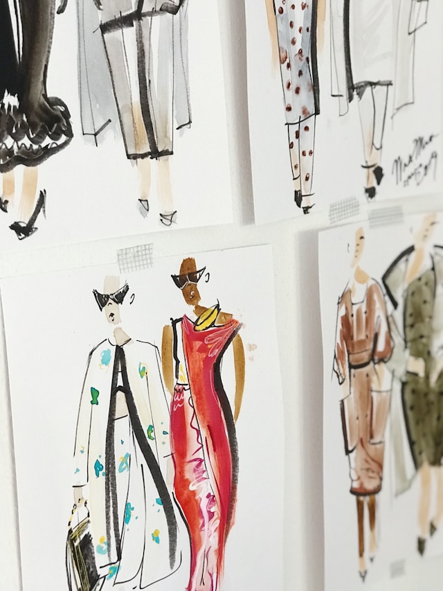 A fashion design workstation with a sewing machine and pattern